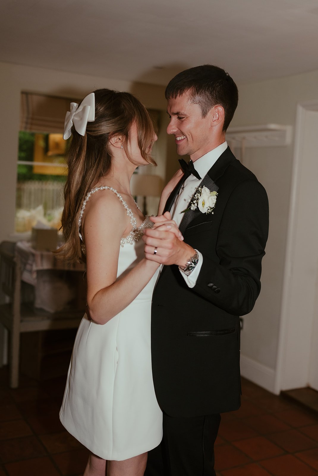 Bride and groom dancing at wedding party