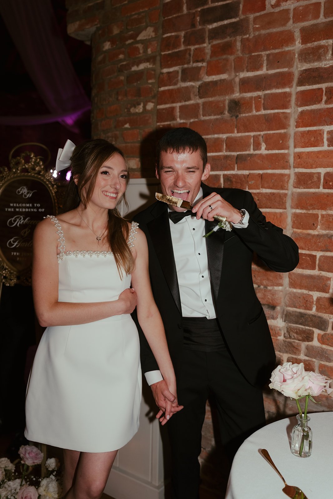 Bride and groom cutting the wedding cake