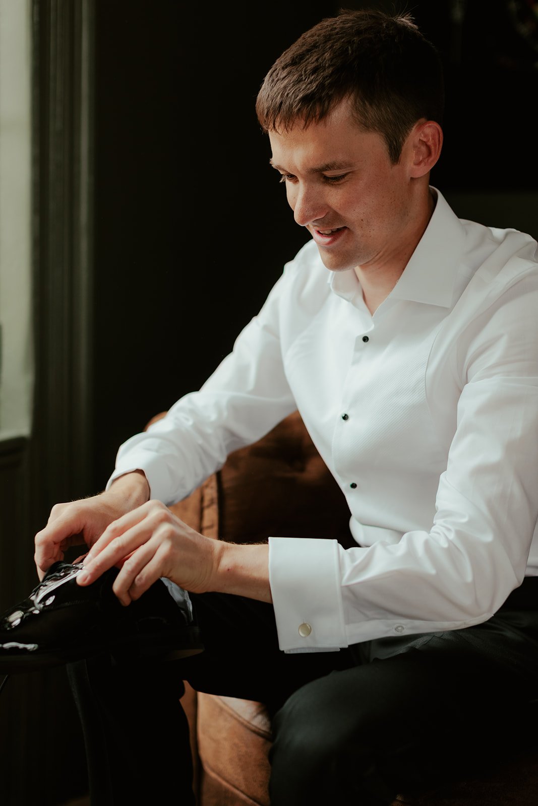 Groom getting ready for the wedding at Worstead Estate