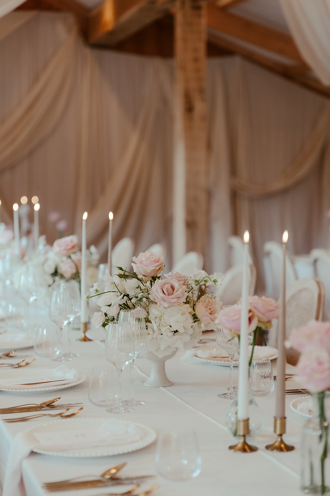 Flowers and candles on the tables for the wedding breakfast
