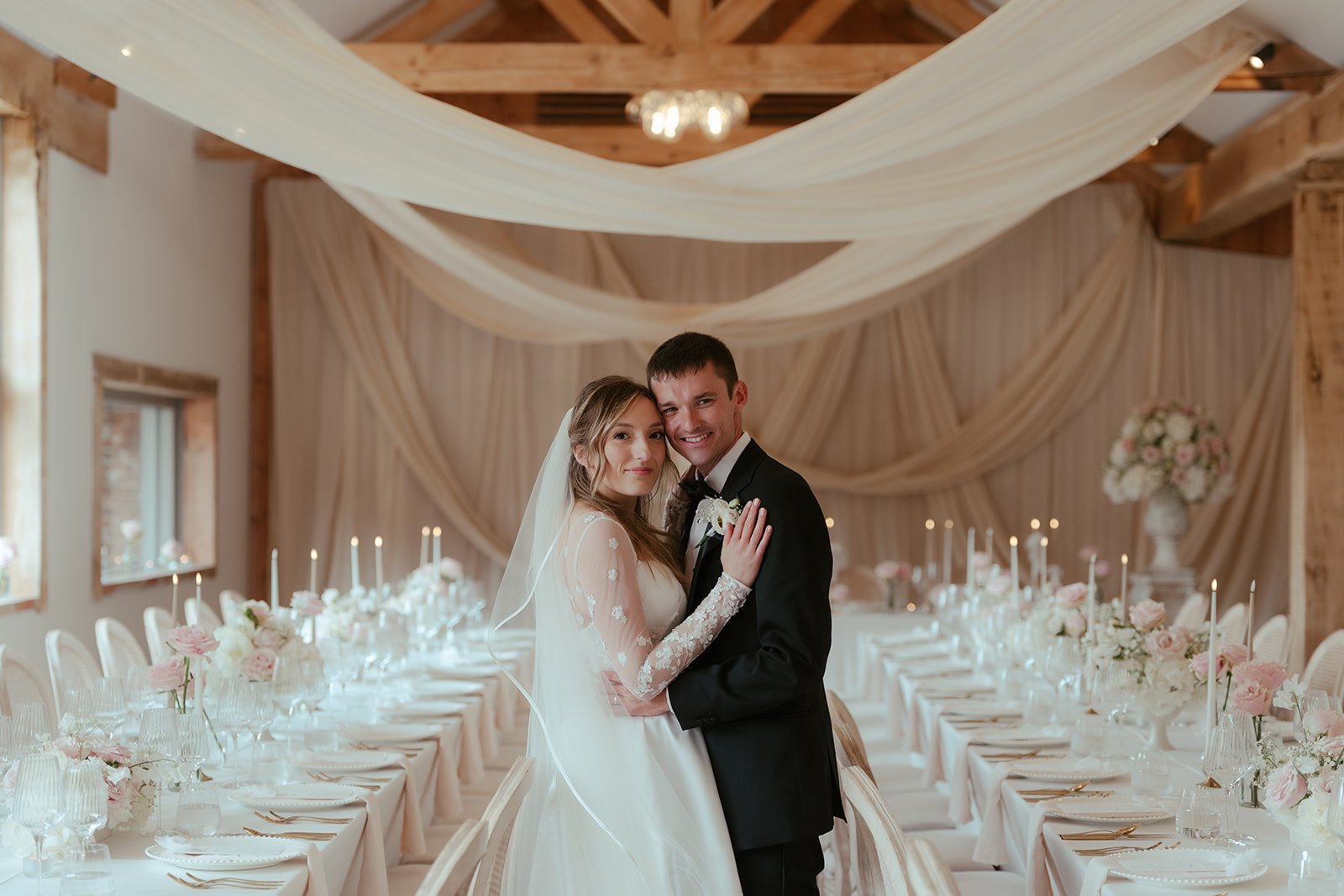 The bride and groom together at the table scape at Worstead Estate, with styling and coordination by Hardesty Event Design