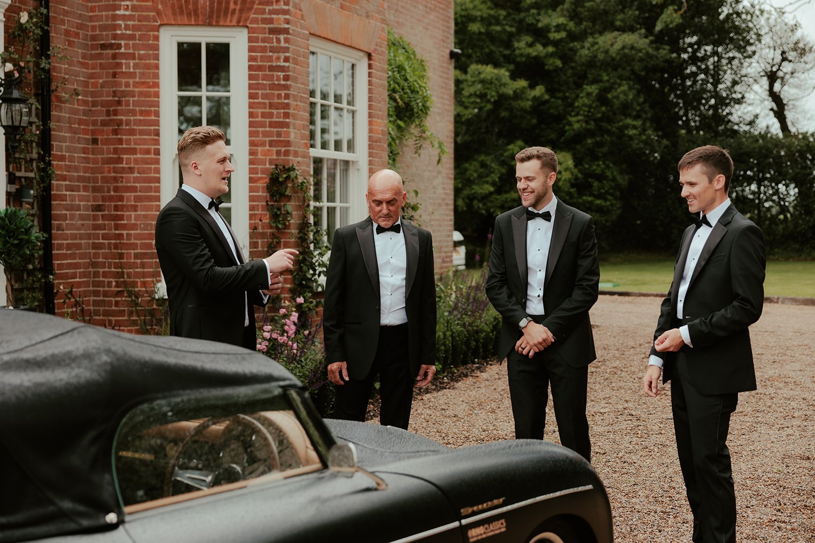 The groomsmen standing together outside worstead estate
