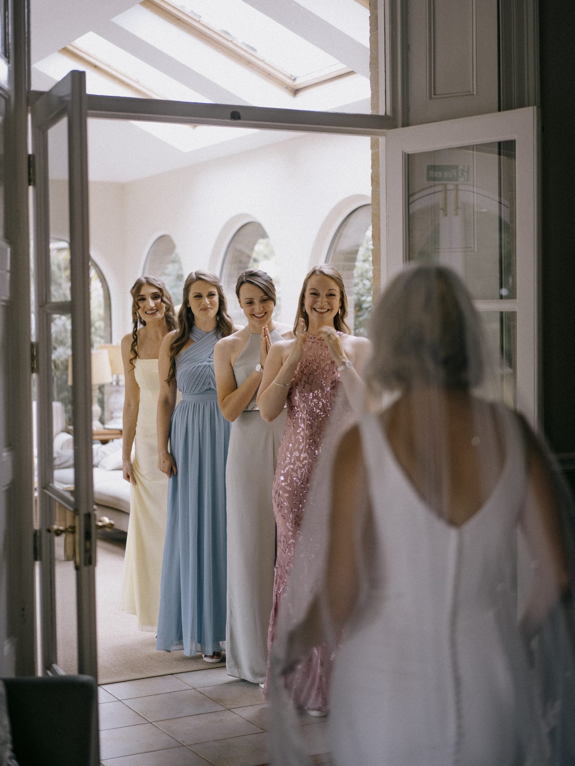 Bride first look with bridesmaids