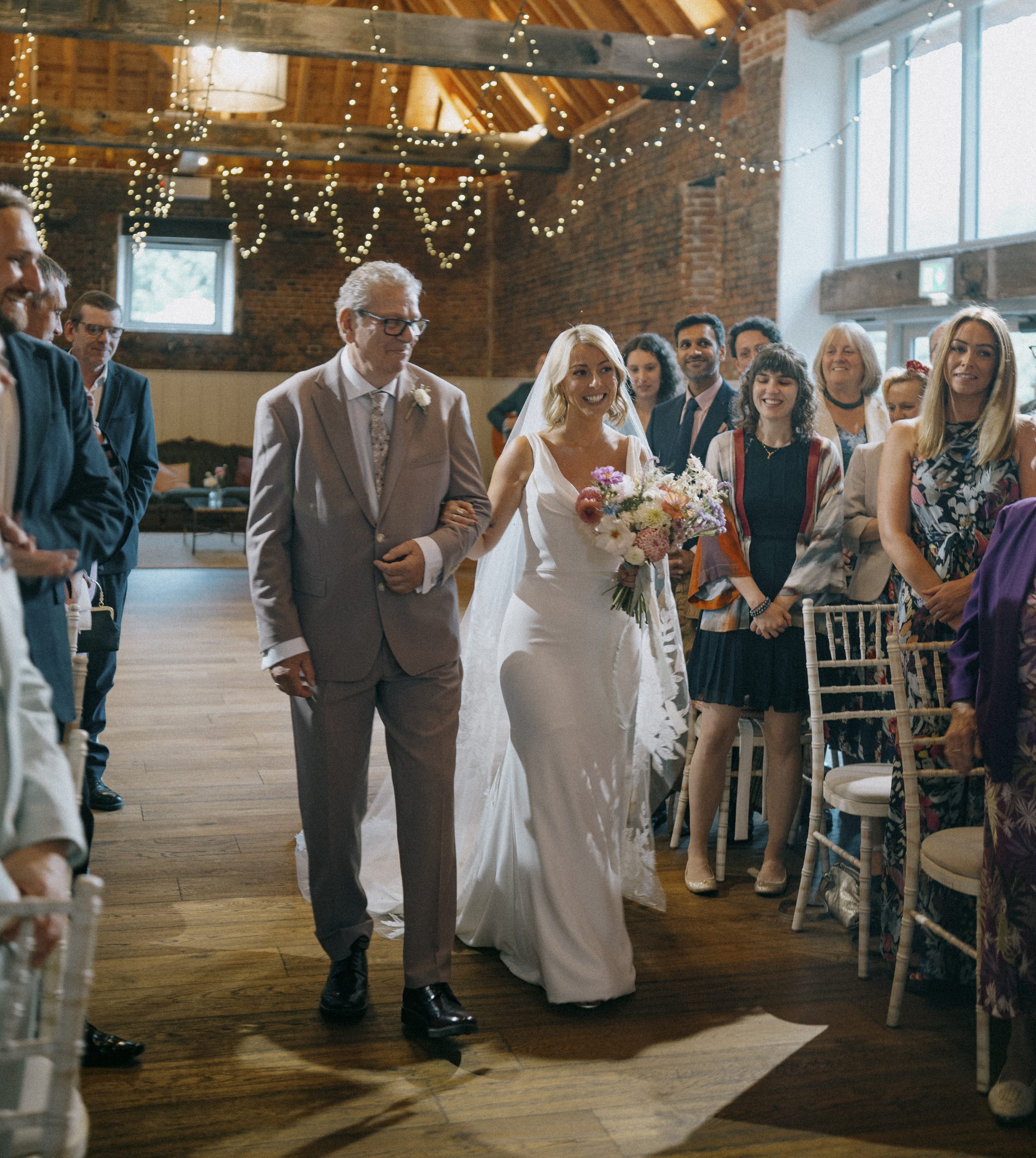 Bride walking down the aisle at Worstead Estate
