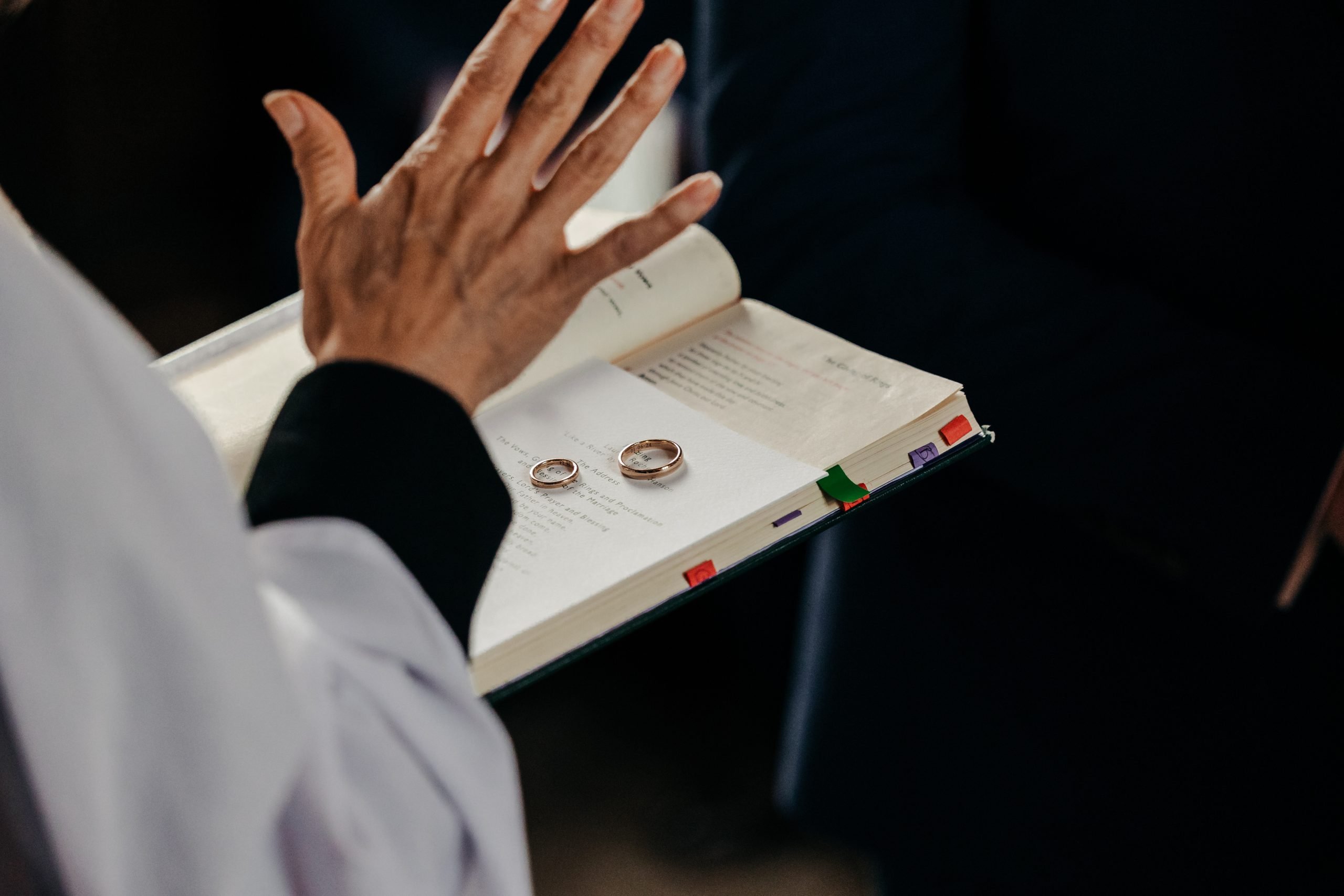 Bride and groom exchanging rings at a high-end country house wedding in Norfolk planned by a luxury UK wedding planner