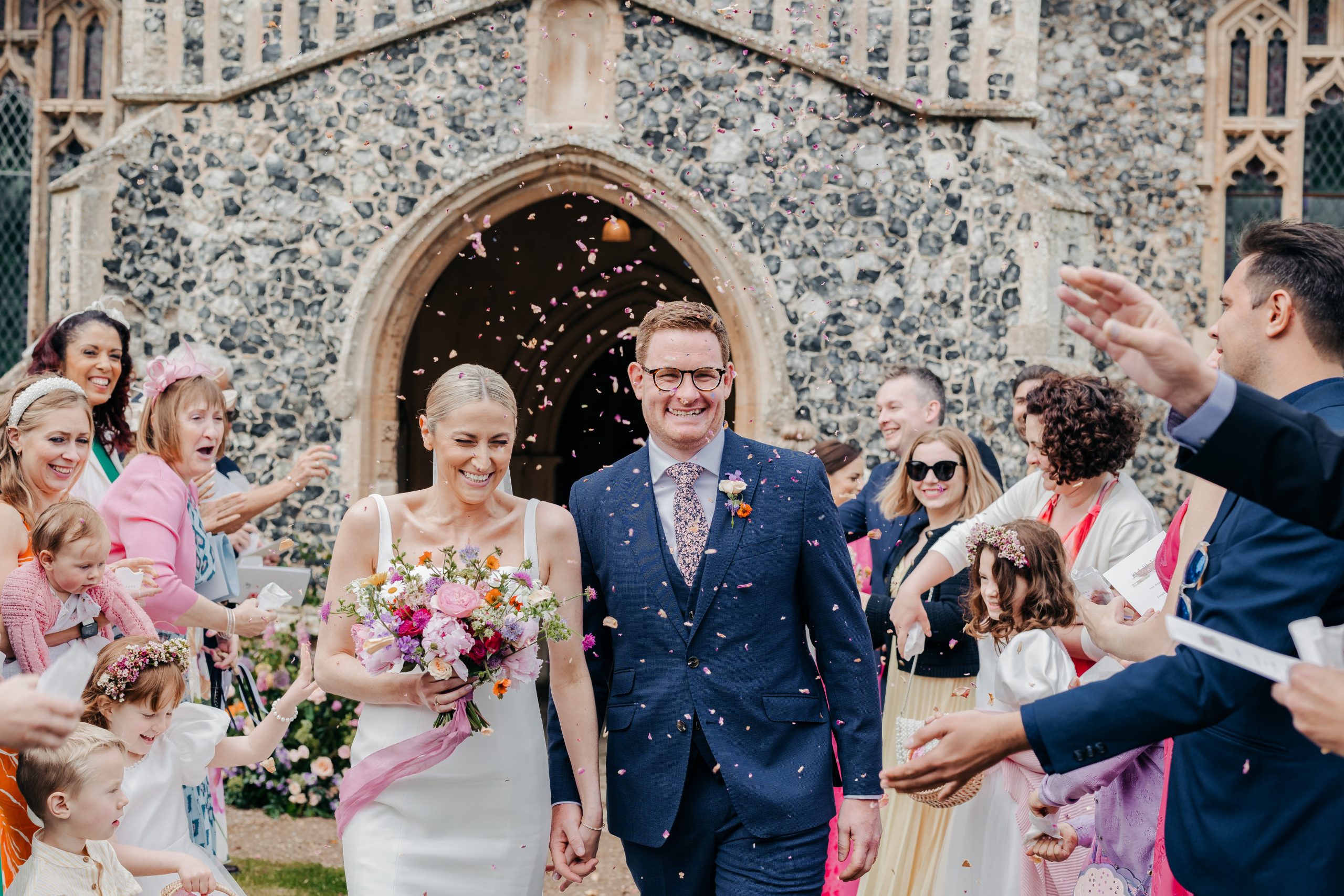 Emma & Luke sharing a moment outside their church, styled by a high-end UK wedding planner and coordinators Hardesty Event Design