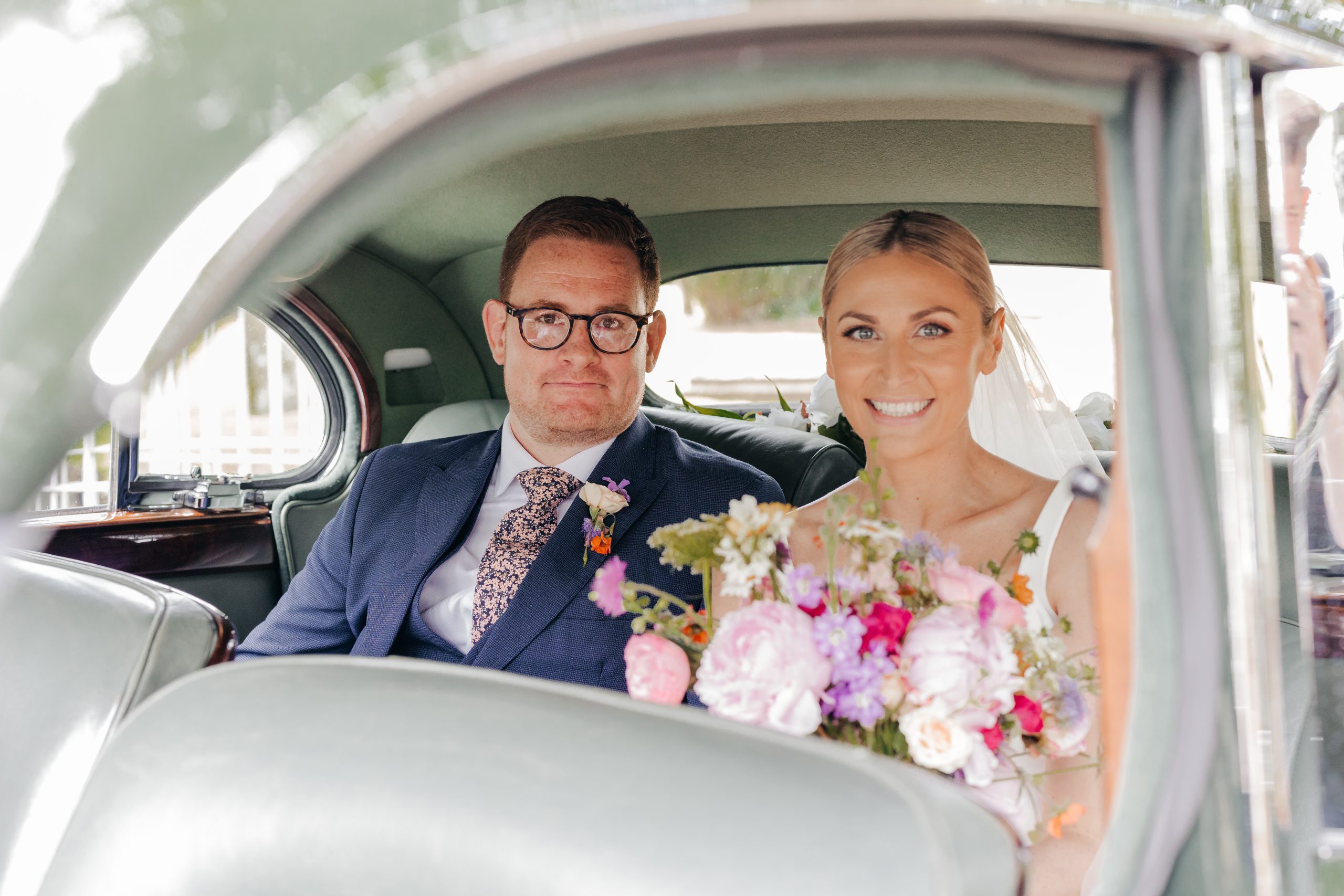 bride and groom on their wedding day following their marriage at a church in Suffolk, coordinated by Hardesty Event Design
