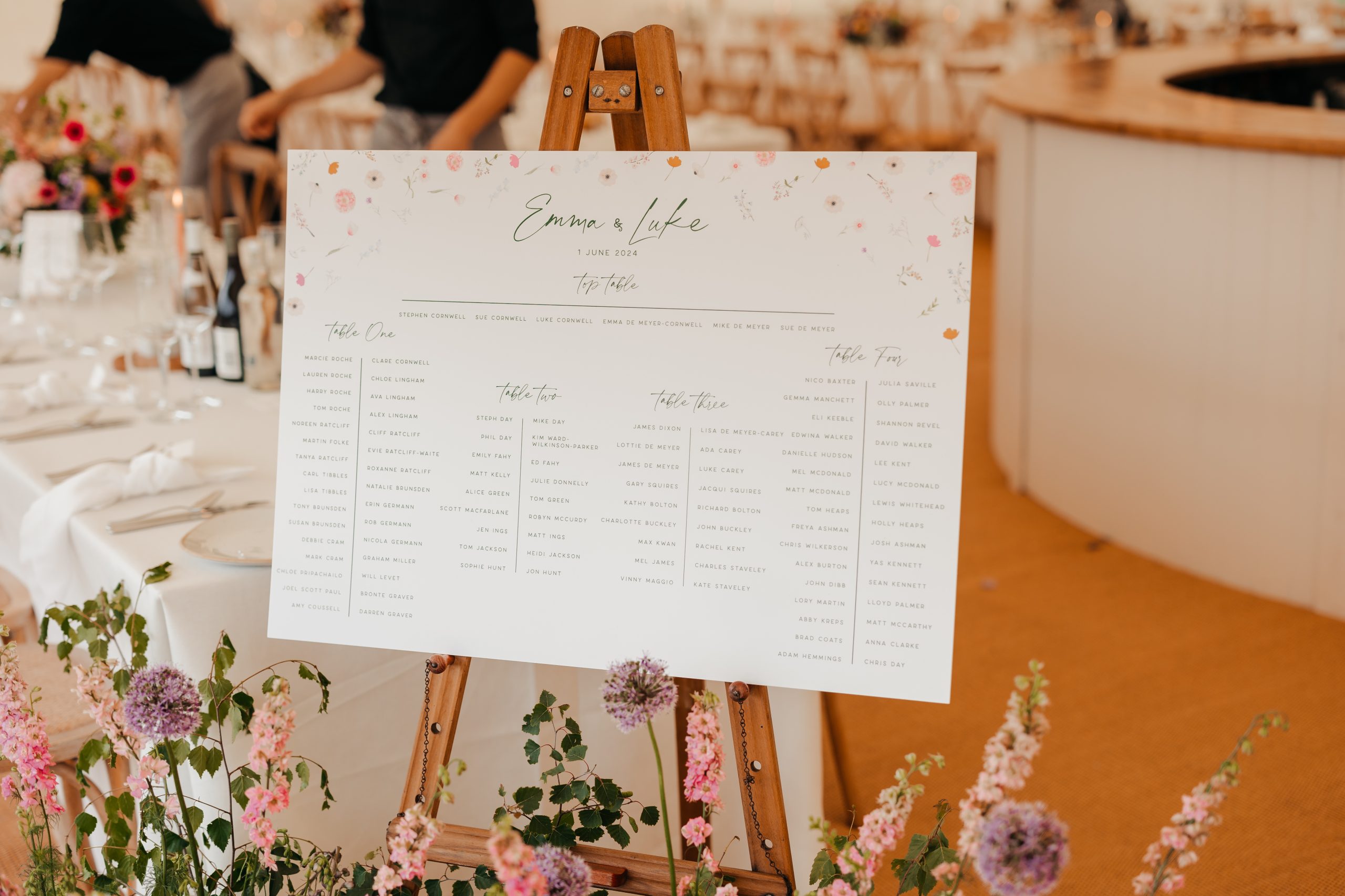 Close-up of elegant stationery and floral décor from a marquee wedding at Helmingham Hall