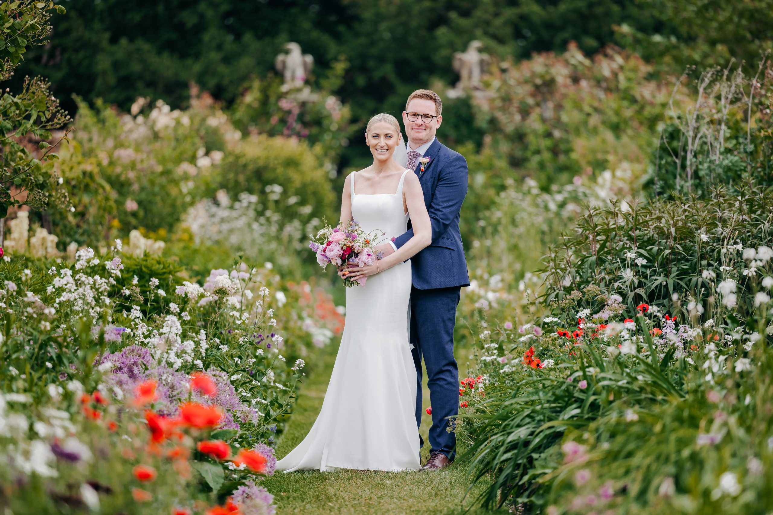 Emma & Luke sharing a moment in the grounds of country house wedding venue, styled by a high-end UK wedding planner Hardesty Event Design