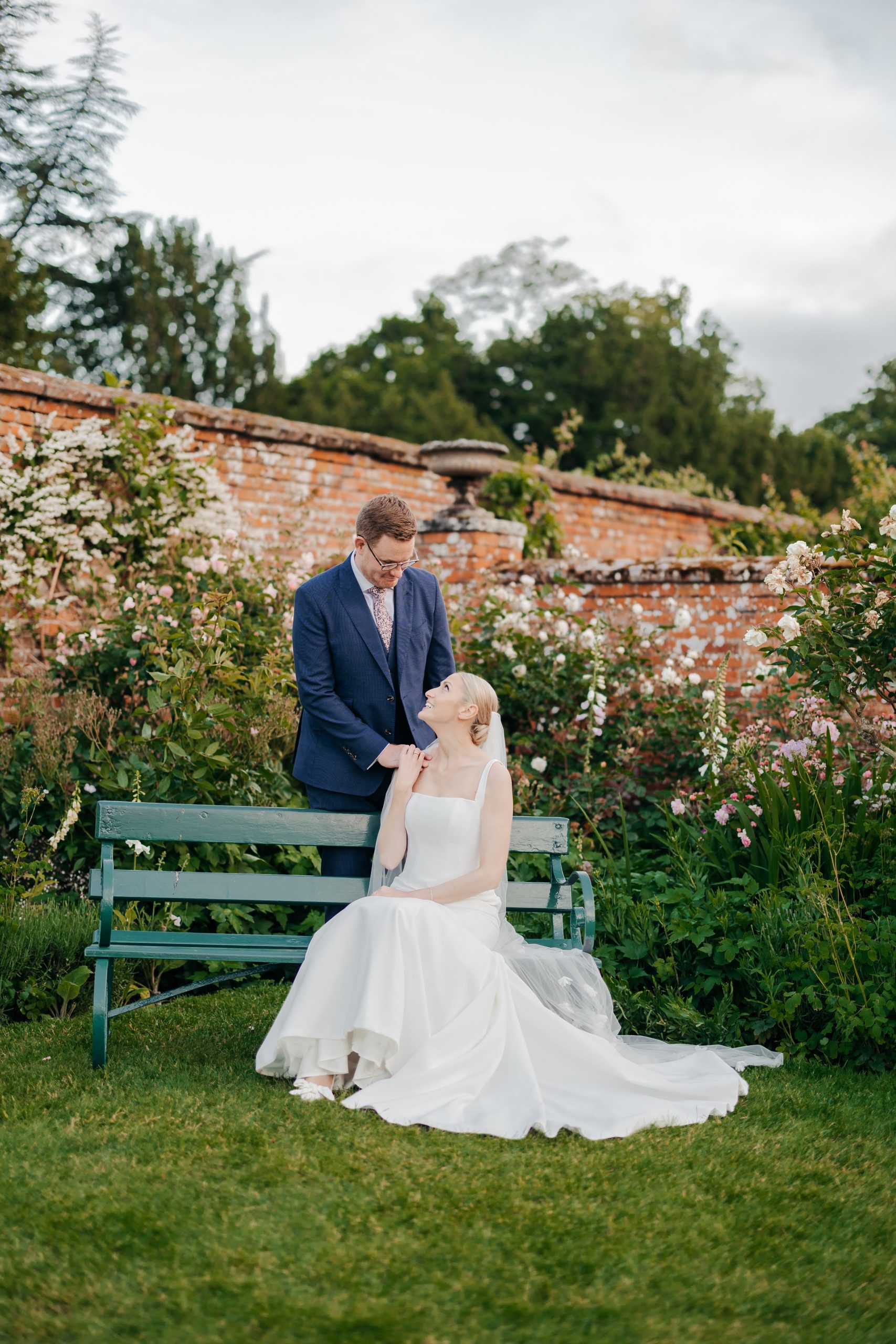 Bride and groom portrait in the grounds of Helmingham Hall during their marquee wedding reception in Suffolk, coordinated by Hardesty Event Design