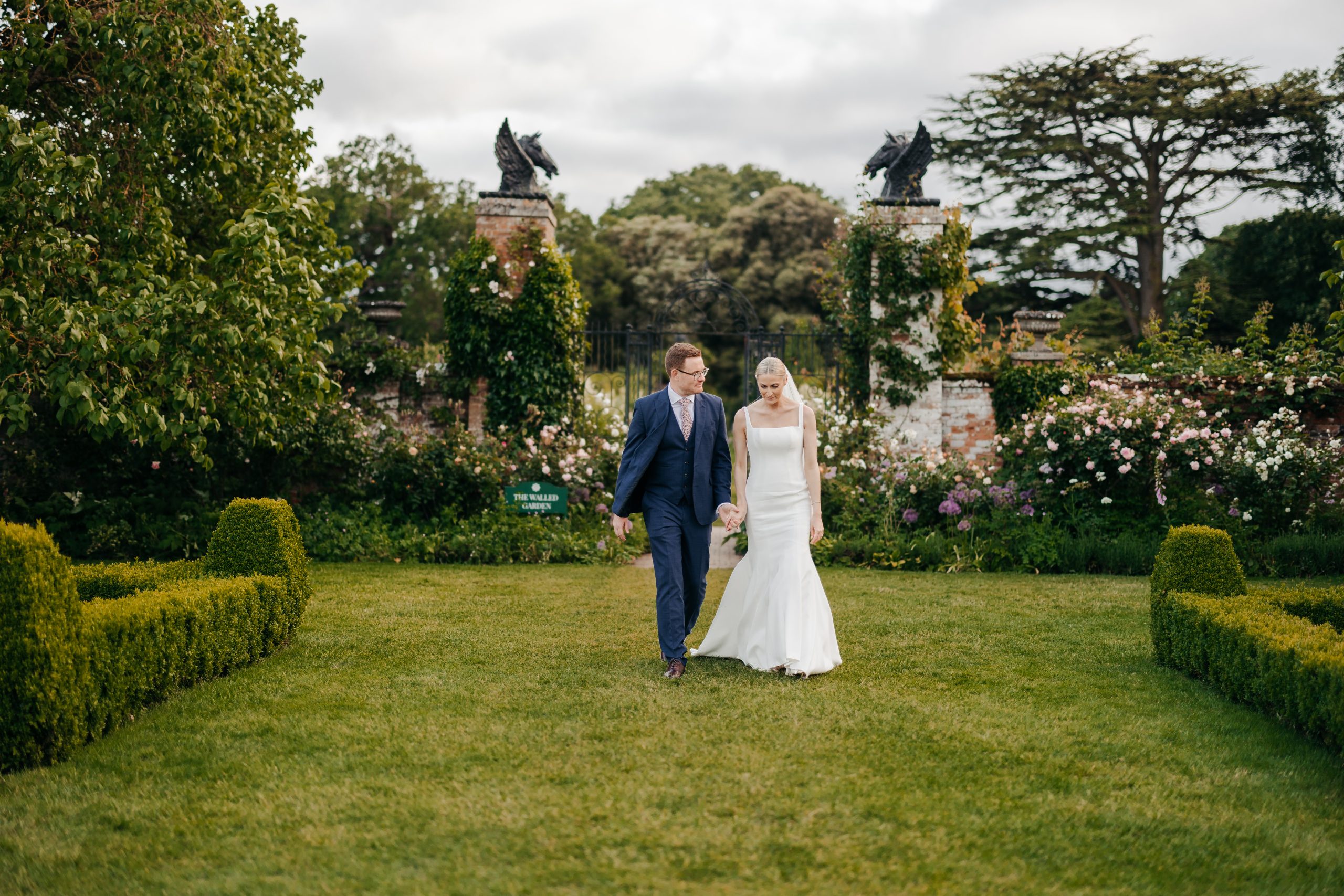 Emma & Luke sharing a moment outside their marquee, styled by a high-end UK wedding planner Hardesty Event Design
