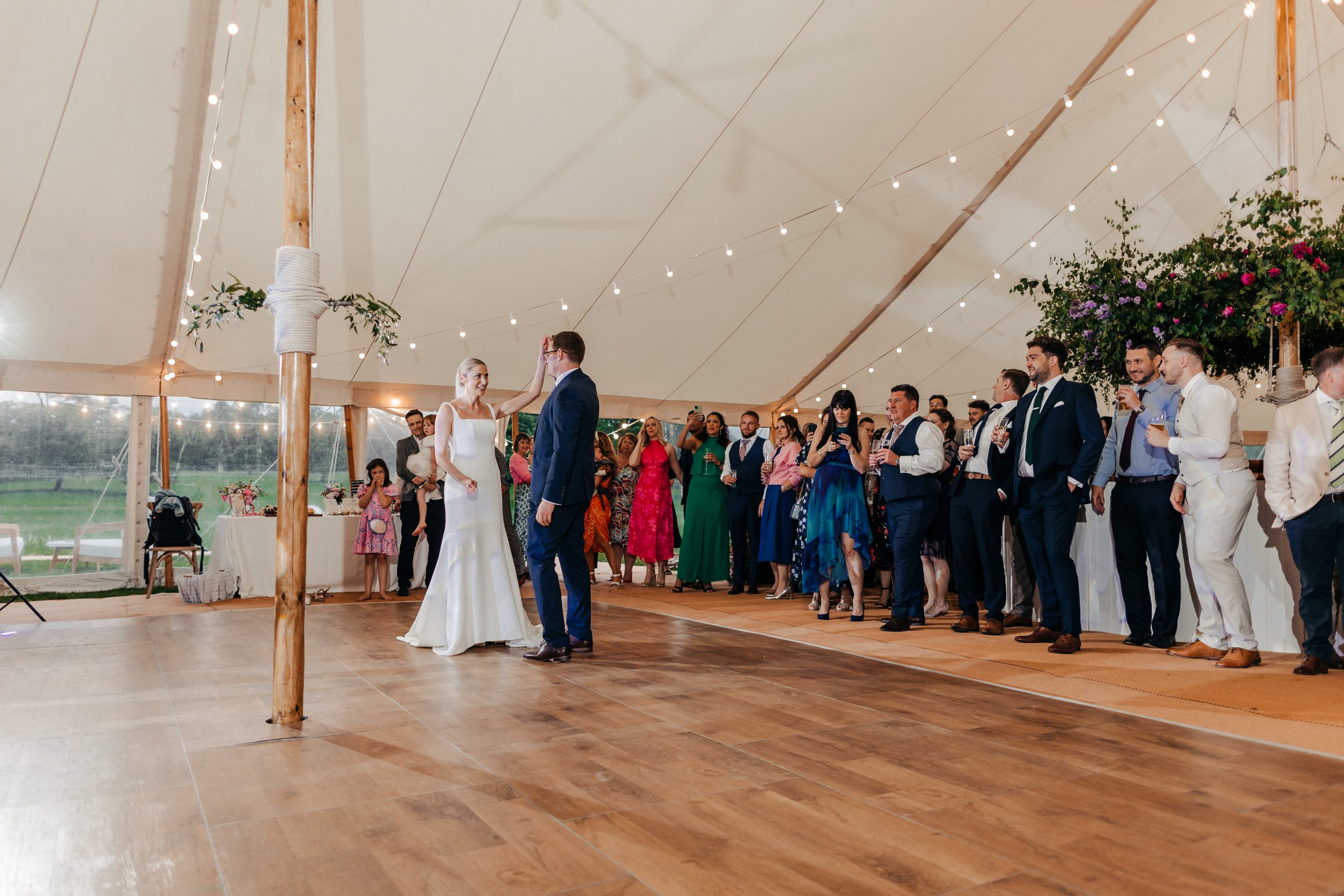 bride and groom enjoying their first dance before the evening marquee reception, coordinated by Hardesty Event Design
