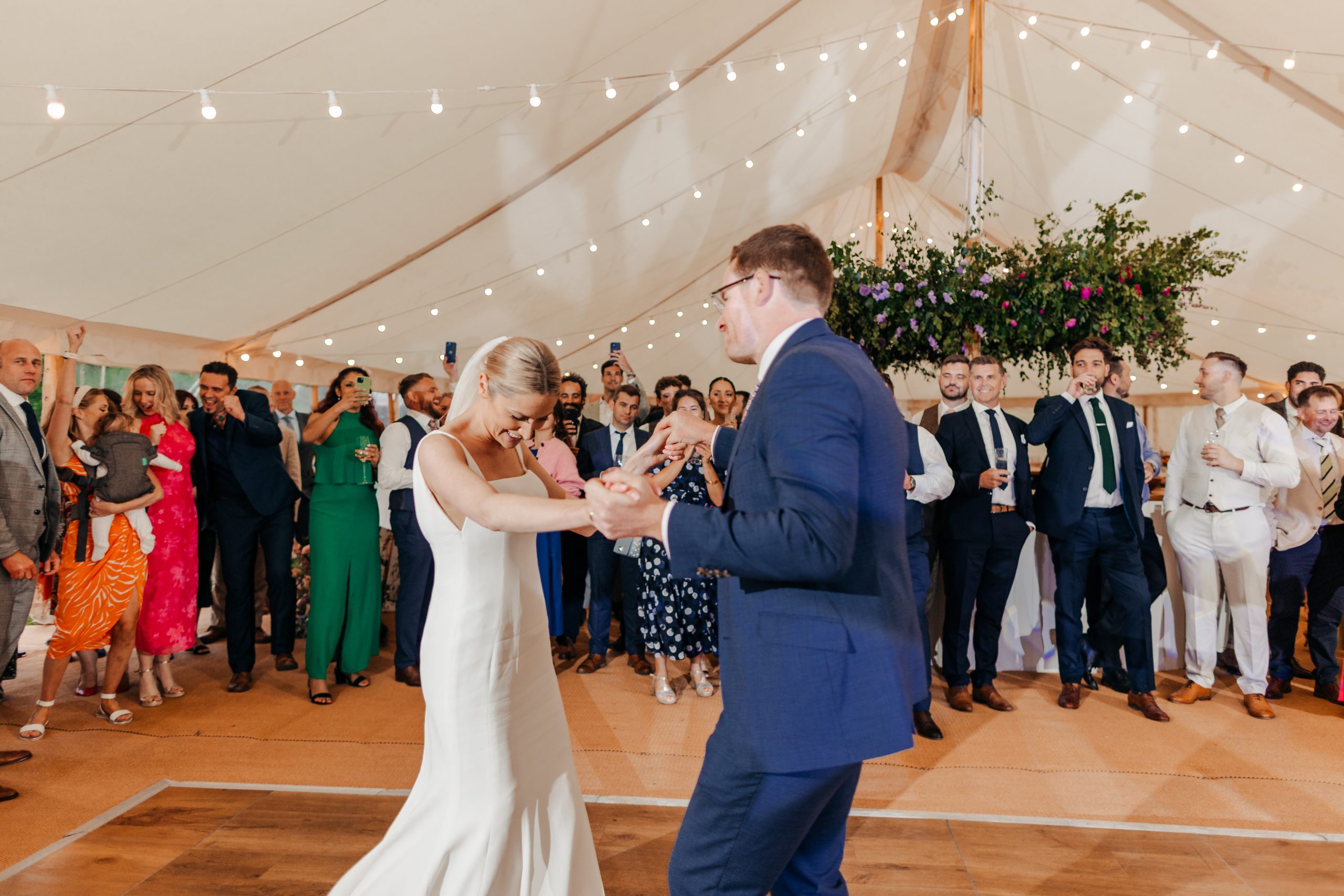 bride and groom enjoying their first dance before the evening marquee reception, coordinated by Hardesty Event Design
