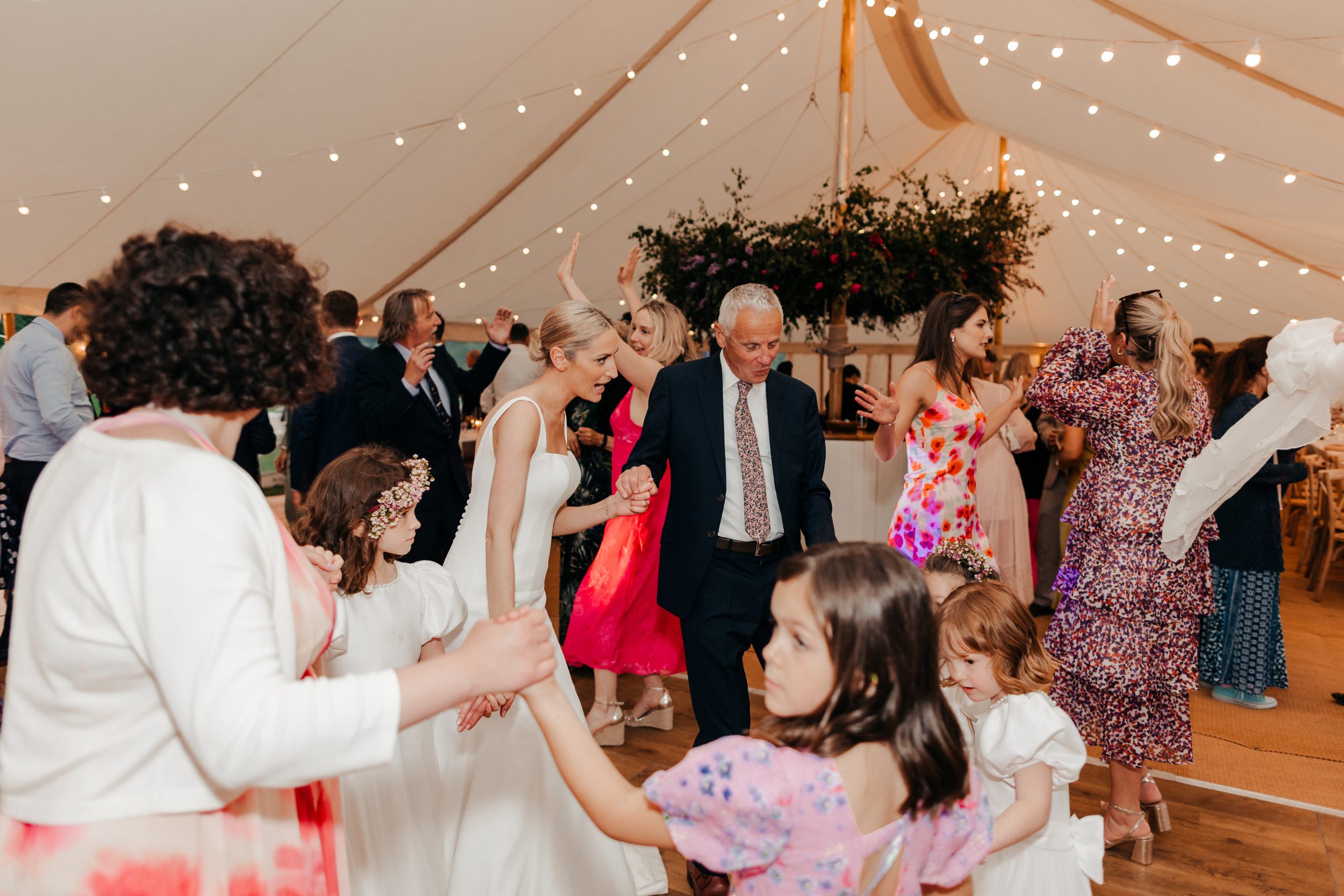 wedding guests at Helmingham Hall, a Country House wedding venue in suffolk for a marquee wedding reception, planned by Hardesty Event Design