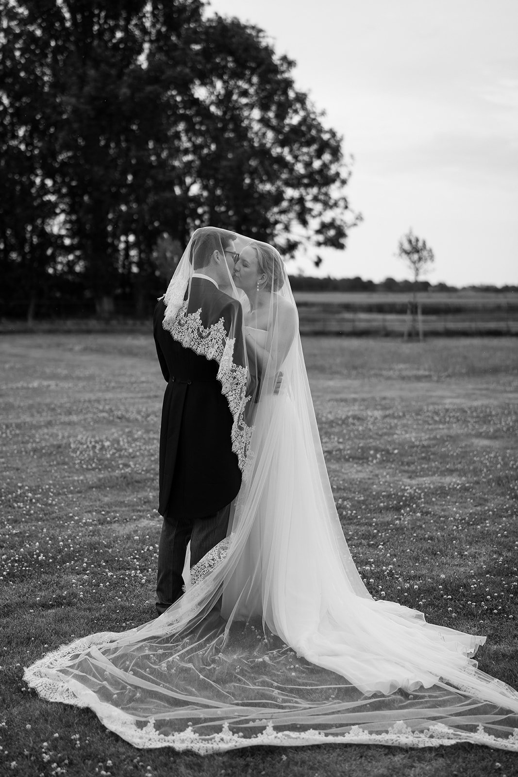 Charlotte and Ed, elegantly captured during their marquee wedding at home planned by a luxury UK wedding planner