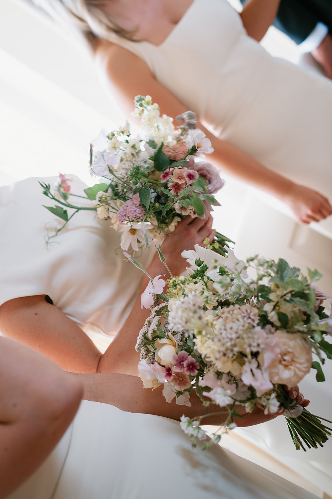 Cream, pink and coral floral arrangement in a marquee wedding styled by a UK luxury wedding planner