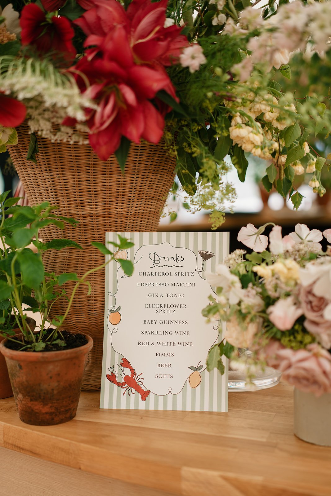 Wedding bar signage showcasing the bride and groom's favourite cocktails and drinks