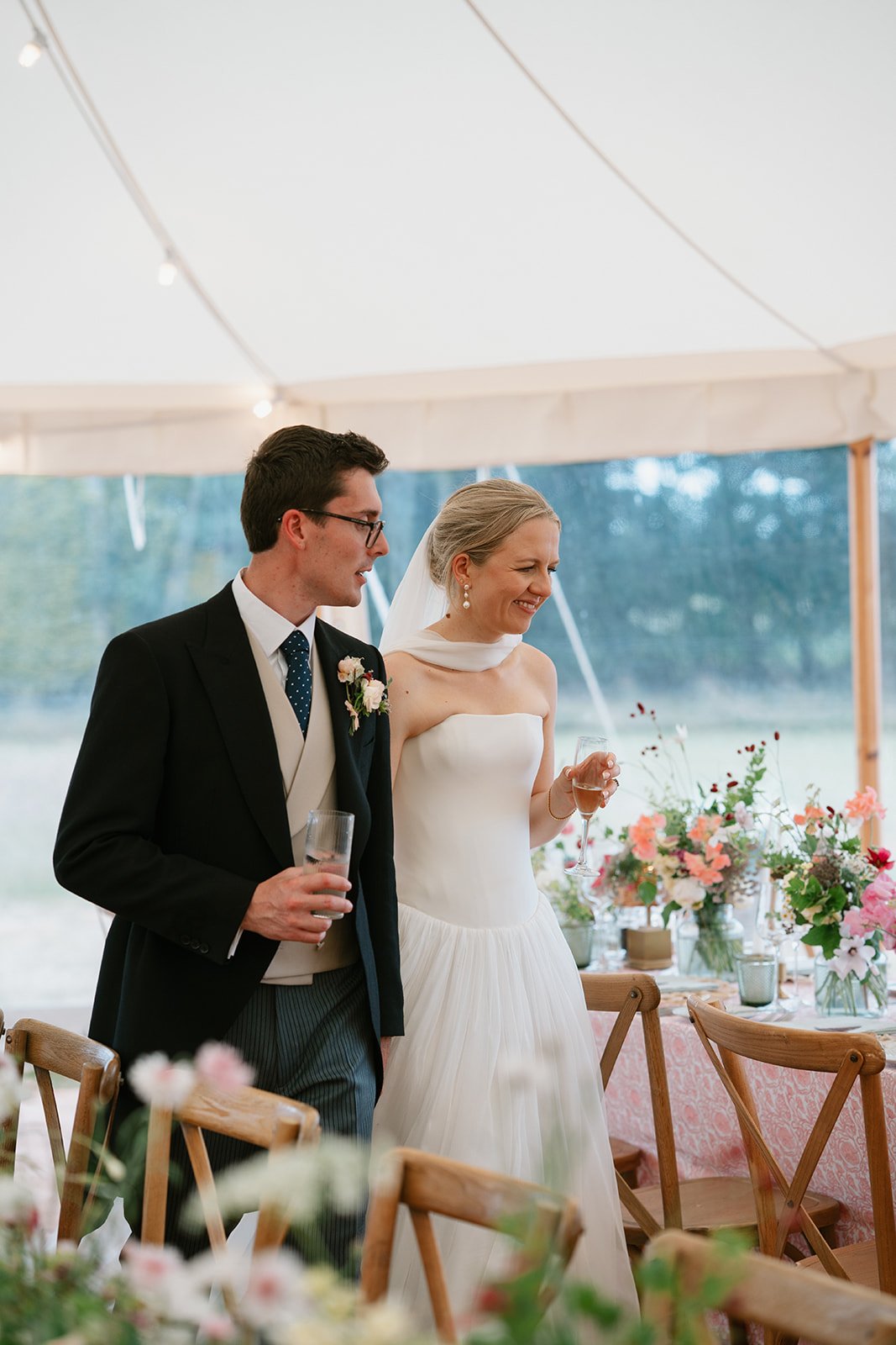 Romantic couple moments during a marquee wedding designed by an expert wedding coordinator in the UK