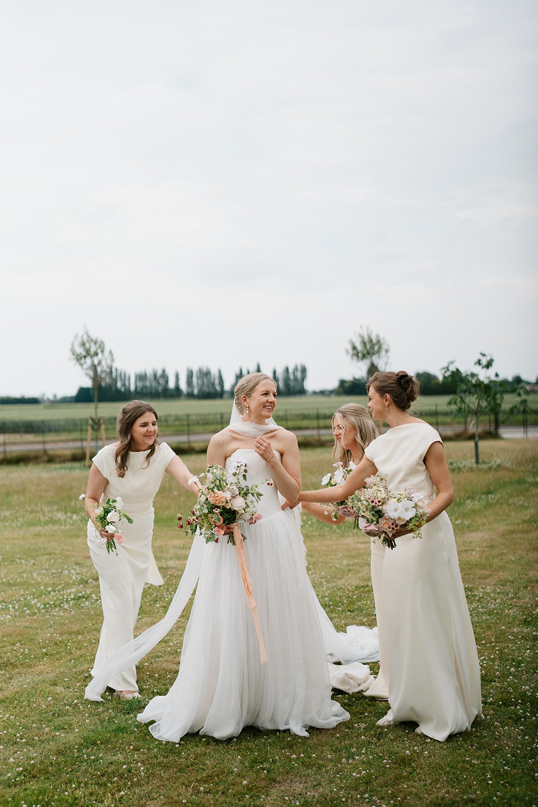 bride and bridesmaids at her at-home marquee wedding in south lincolnshire