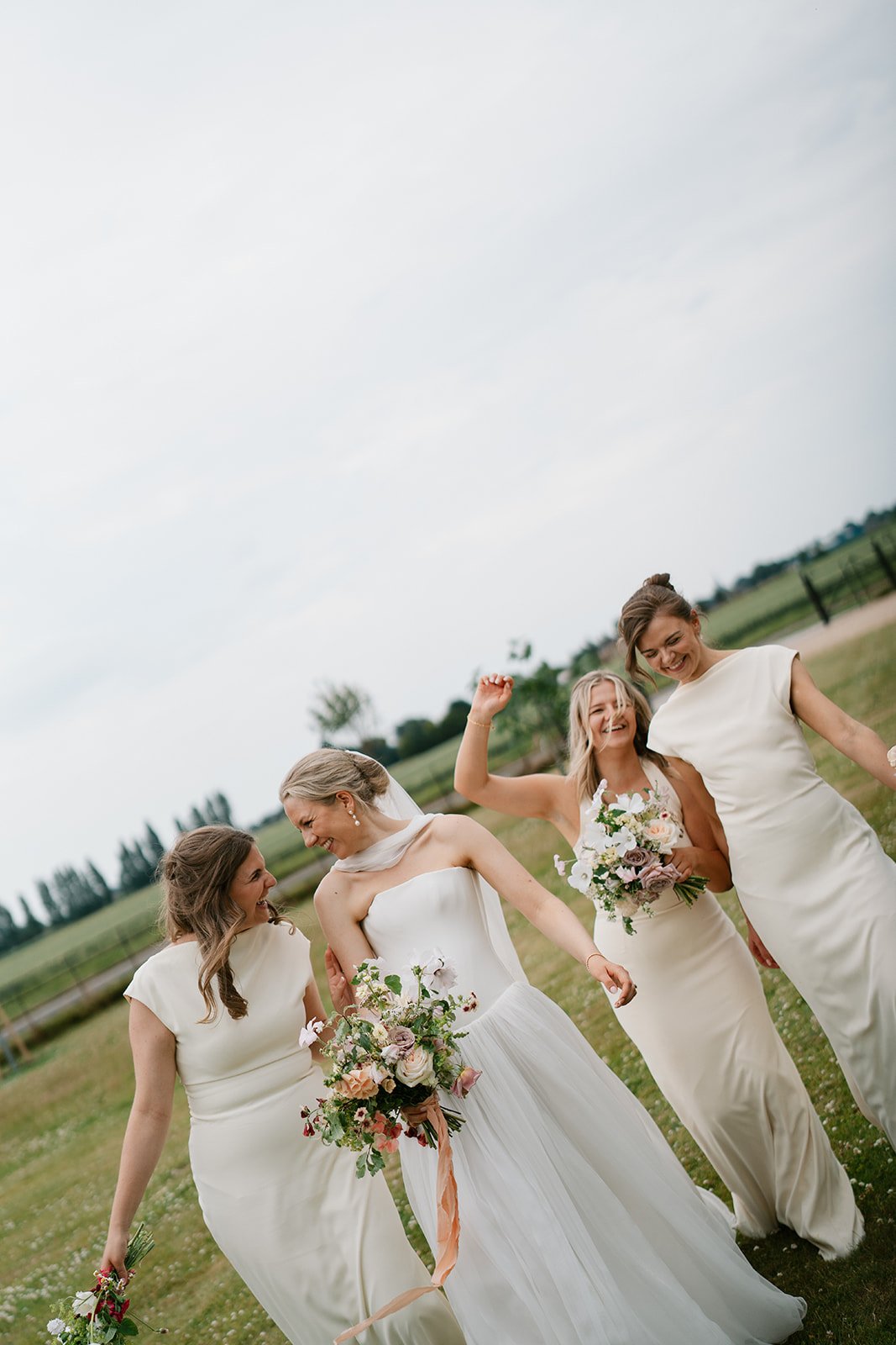 bride and bridesmaids at her at-home marquee wedding in south lincolnshire, coordinated by Hardesty Event Design