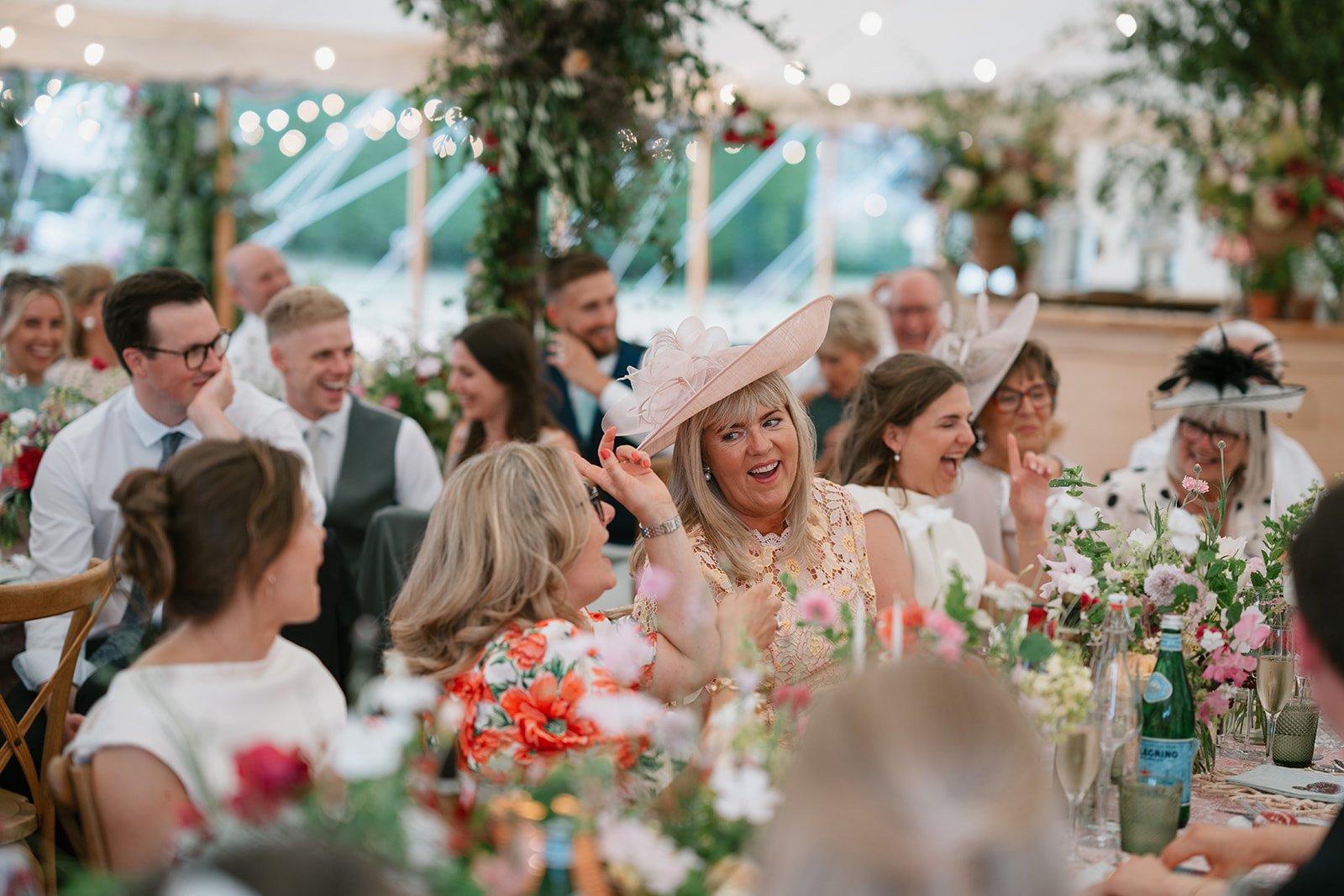 wedding guests in marquee for wedding breakfast and speeches at a sophisticated marquee wedding reception, perfectly planned by UK wedding planners Hardesty Event Design
