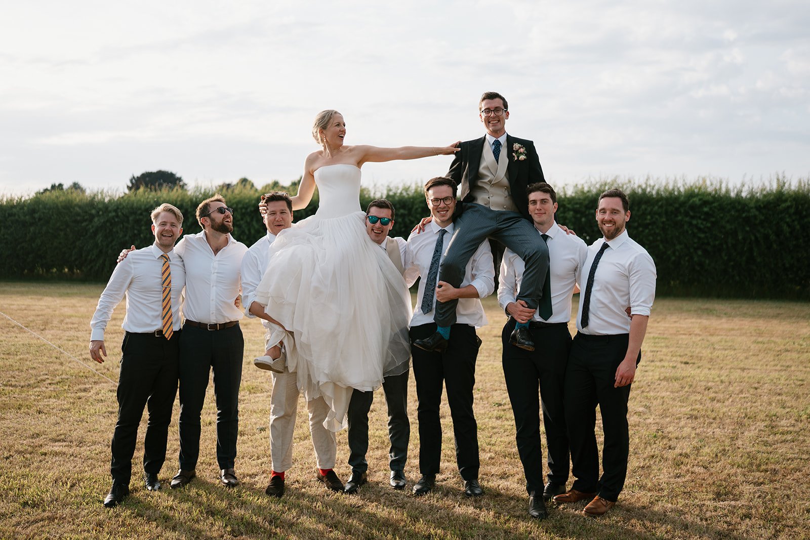 bride and groom with wedding guests at their garden marquee wedding reception coordinated by Hardesty Event Design