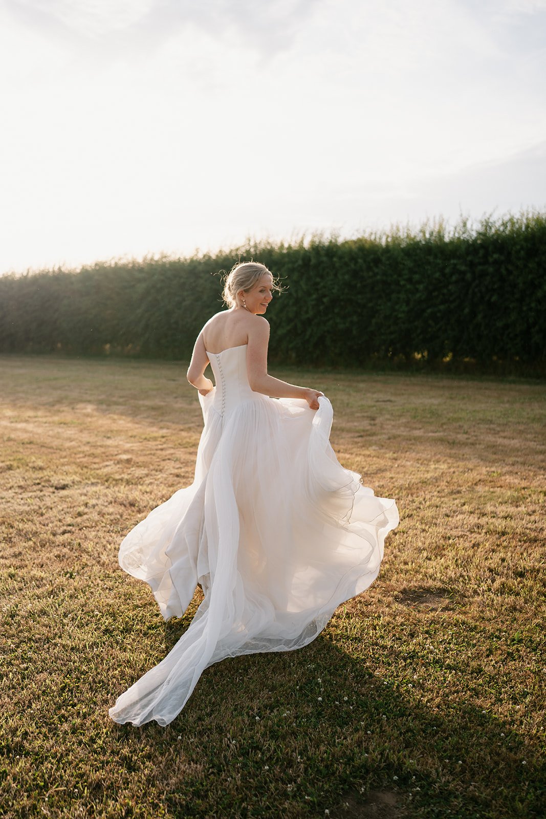 bride on wedding day in bespoke Emma Beaumont wedding gown, coordinated by uk wedding planner