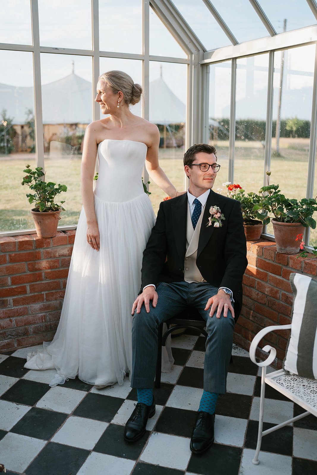 Charlotte and Ed, elegantly captured during their marquee wedding at home planned by a luxury UK wedding planner