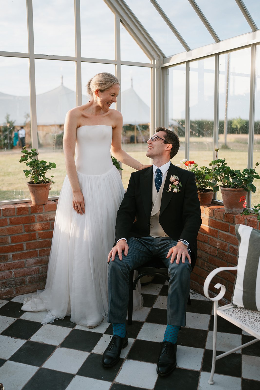 Charlotte and Ed, elegantly captured during their marquee wedding at home planned by a luxury UK wedding planner
