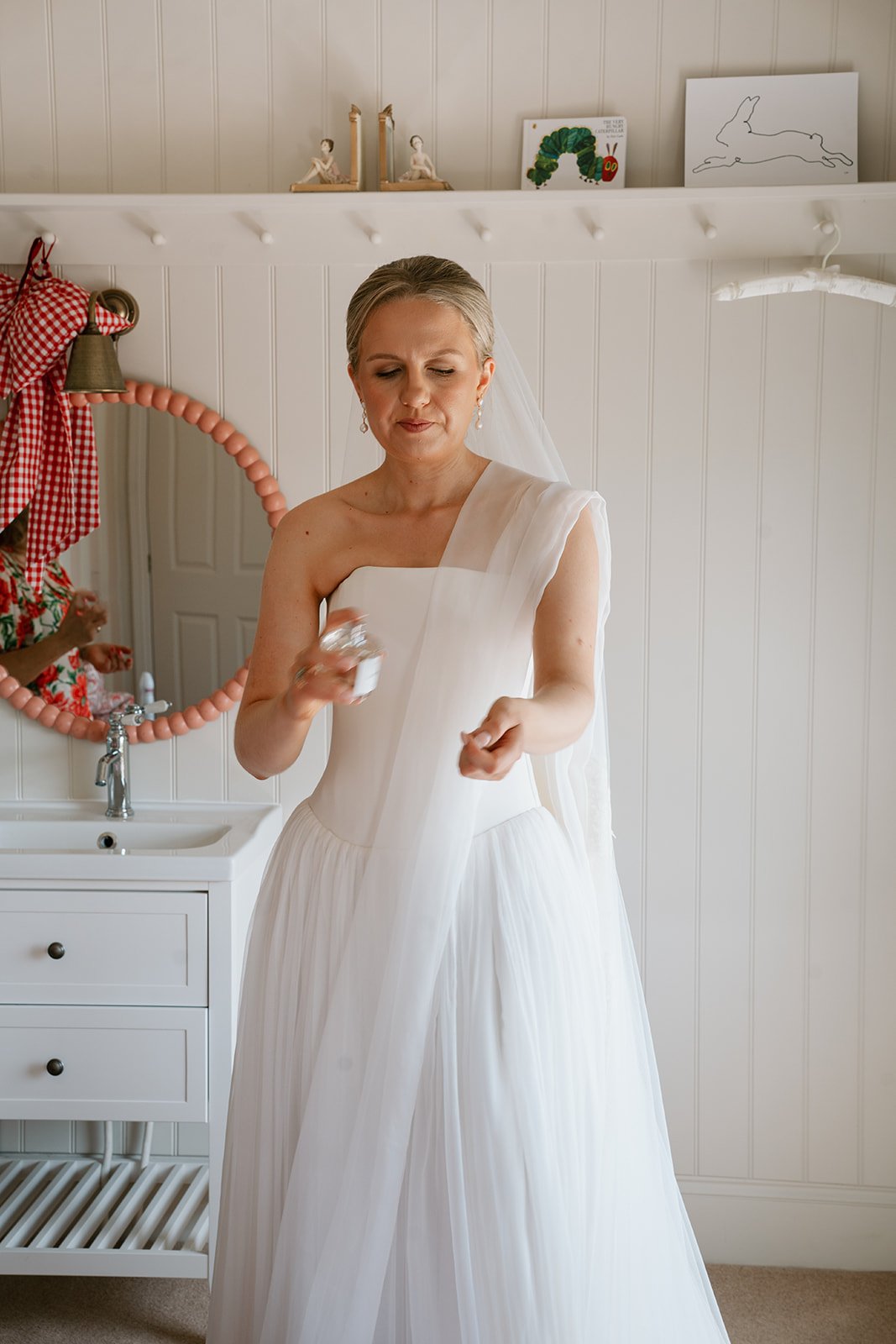 bride, charlotte getting ready before her church wedding in Lincolnshire, planned by luxury UK wedding planner Hardesty Event Design