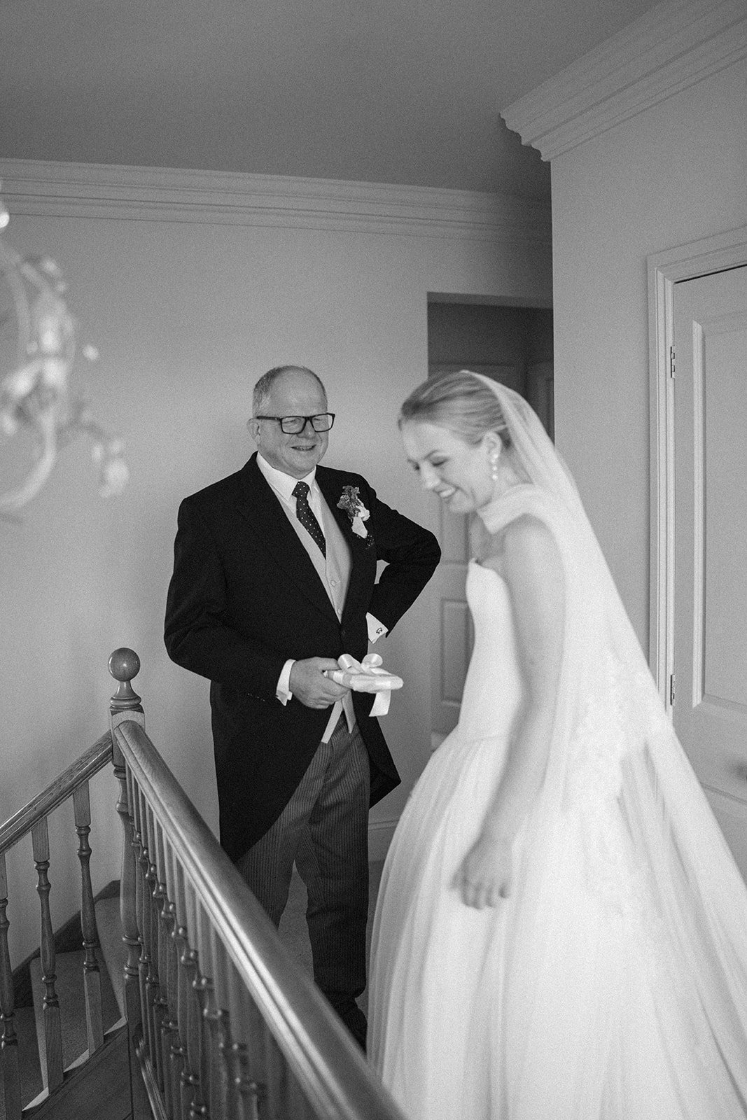 Father of the bride seeing his daughter for the first time on her wedding day at their home in Lincolnshire before a marquee wedding reception planned by UK wedding planners, Hardesty Event Design